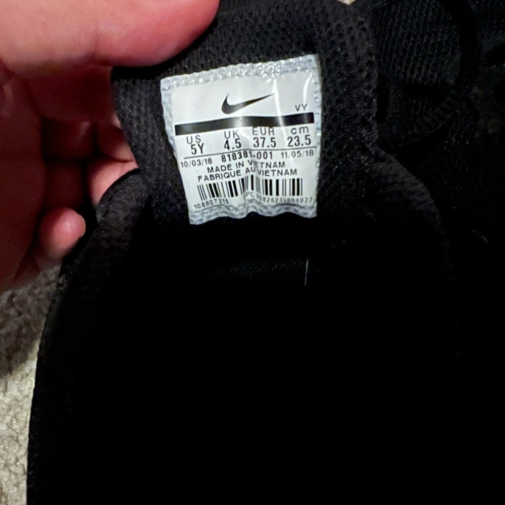 All black Nikes. Kids 5 but fits women size 7.